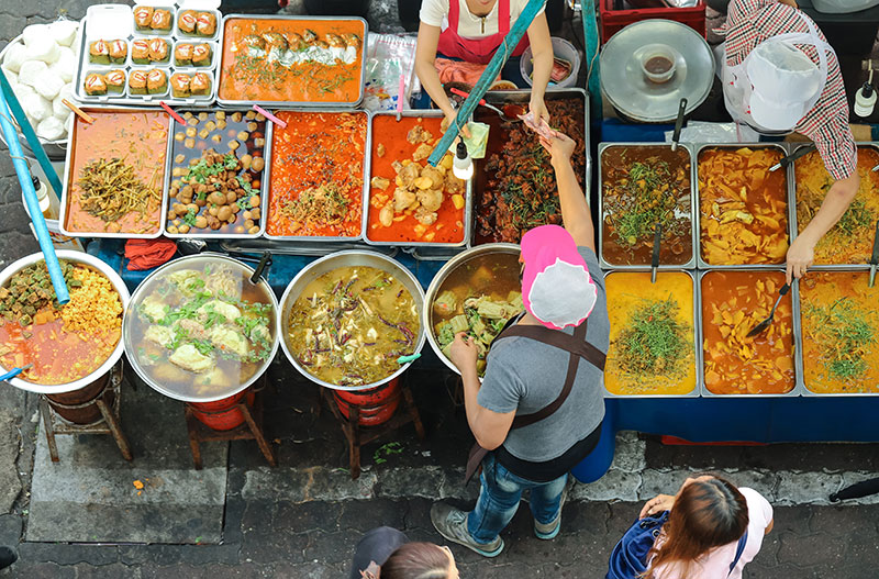 People enjoying street food display