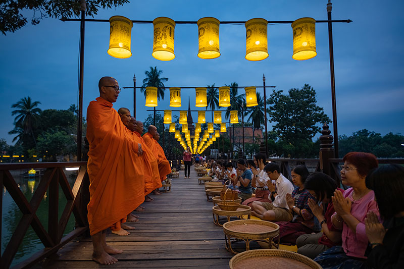 photo of people donating to monks on vesak